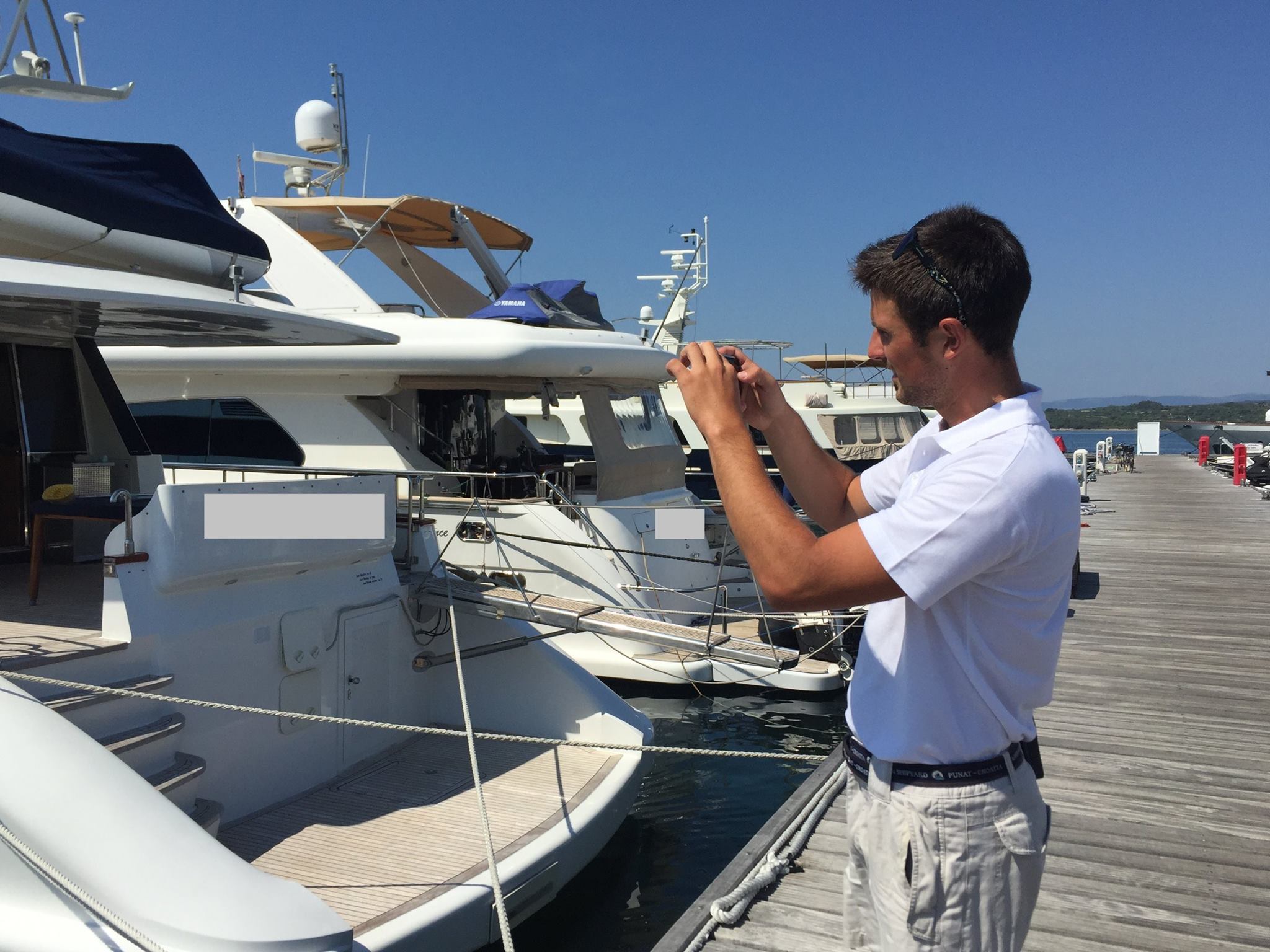 marina punat facebook marina staff on his duty, checking and taking photo of each boat in the marina with report.jpg