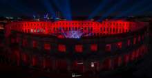Pula amphitheatre lit red in support of the events industry