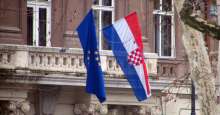 Croatian flag and EU flag flying outside Croatian Embassy, not in Sarajevo