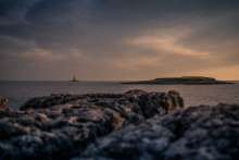 The Sun Shines Spotlight on Isolated Croatian Porer Lighthouse
